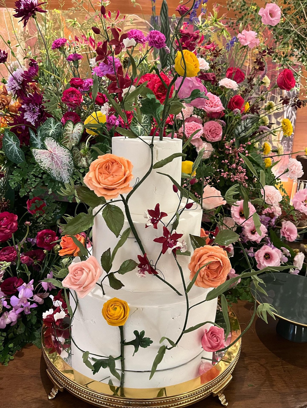 Celebration cake covered in fresh flowers